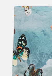 Molo NIKI - Tajice-hlače - black/light blue