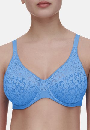 Light blue lace bra with underwire. Floral pattern overlay on cups, adjustable straps, and soft fabric. Smooth band and seamless design.