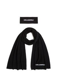 Mustascharf ja peapael komplekt, mis on valmistatud pehmest kangast. Sall on pikk ja ripub elegantselt; peapaelal on kirjas tikitud 'KARL LAGERFELD' logo.