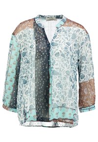 Blusa trasparente a più fantasie con motivi floreali e geometrici in turchese, nero e marrone, con una vestibilità morbida e scollo a V.