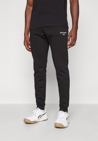 Björn Borg ESSENTIAL PANTS - Treniņtērpa apakšdaļas - black beauty
