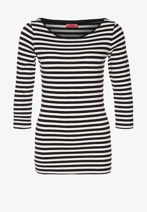 Haut à manches longues rayé noir et blanc avec un col arrondi, fabriqué en tissu doux, présentant des rayures horizontales uniformément espacées.