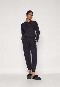 Calvin Klein Underwear FRENCH TERRY LOGOPANTS - Spodnji del pižame - black
