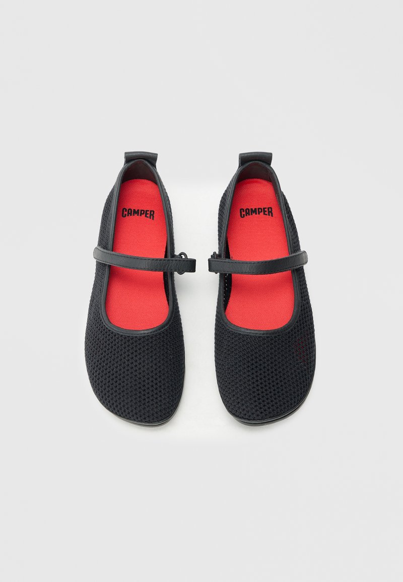 Black mesh Mary Jane shoes with a red insole, featuring a adjustable strap and rounded toe design, providing breathability and comfort.