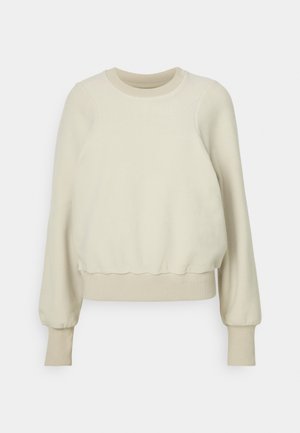 Sweatshirt beige clair en tissu doux, avec des manches longues, un col rond, un ourlet froncé et des poignets côtelés. Design minimaliste.