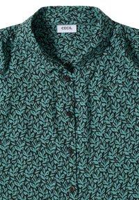 Groen overhemd met knopen, zwart bladpatroon en puntkraag, met een zichtbaar merkembleem bij de halslijn.