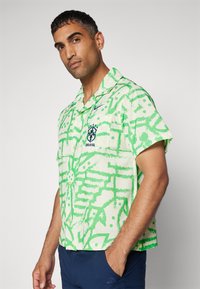 Nike Performance BRASIL BOWLING BUTTON UP - Vapaa-ajan kauluspaita - alabaster/light green spark/deep royal blue