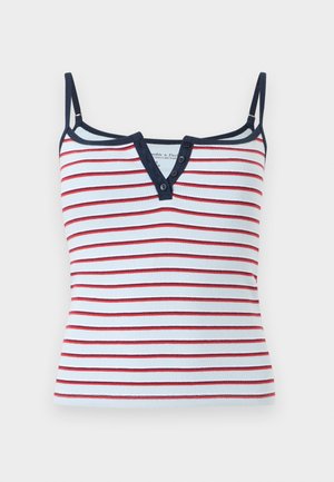 Λευκό ριγε καμίσολ με κόκκινες οριζόντιες ρίγες, μπορντούρα σε σκούρο μπλε, λεπτές ρυθμιζόμενες τιράντες και ντεκολτέ σε σχήμα V με κουμπιά.