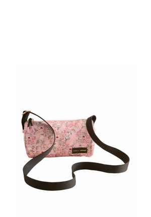 Pink cylindrical bag featuring a floral pattern with cartoon characters, black strap, and a gold zipper. Textured fabric with a glossy finish.