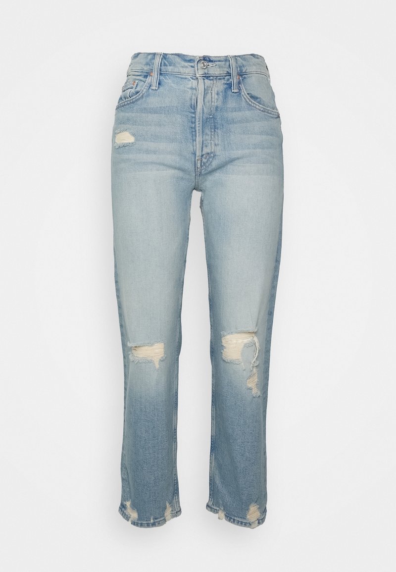 Jean taille haute bleu clair avec plusieurs patchs usés et ourlets effilochés, présenté sur un fond blanc uni.
