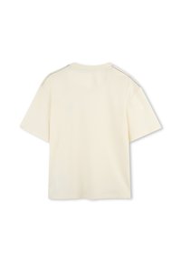 Lichtcrème korte mouwen t-shirt met een ronde halslijn en contrasterende stiksels langs de schouders. Soepele textuur en een ontspannen pasvorm.