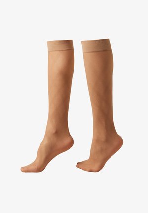 Calcetines beige hasta la rodilla, fabricados con material transparente, con un patrón de diamantes y una puntera reforzada, y con puños acanalados para un ajuste seguro.