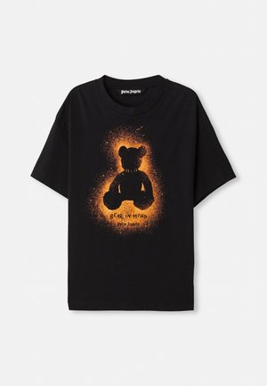 Black cotton t-shirt featuring a silhouette of a bear in orange with a textured halo effect. The front includes the text "BEAR IN MIND."