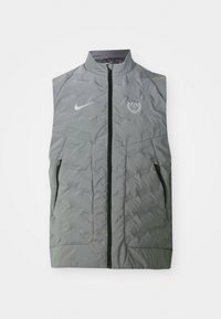 Gray Nike sleeveless vest with a front zipper, quilted texture, two side pockets, and a circular Paris logo on the left chest.