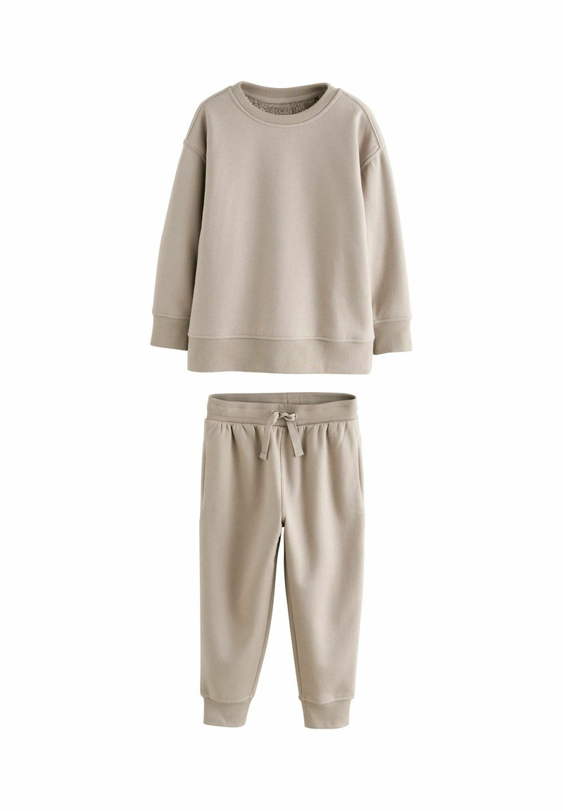 Hellbeige zweiteiliges Sweat-Outfit bestehend aus einem Crewneck-Sweatshirt mit gerippten Bündchen und passenden Jogginghosen mit elastischem Bund und Kordelzug.
