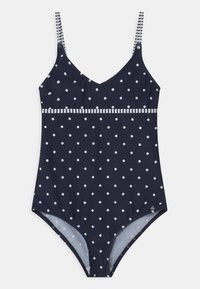 Navyblauer Badeanzug mit weißen Punkten, gestreiften Trägern und einem strukturierten Band an der Taille. Glatte Stoffoberfläche.