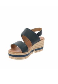 Sandaletta nera in pelle con zeppa, due cinturini larghi, soletta imbottita color nocciola e suola intermedia in juta intrecciata con accenti blu e beige.