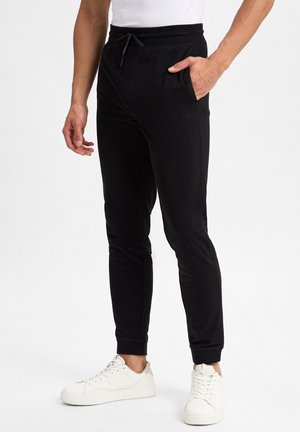 Nils Sundström, Pantalon de survêtement - schwarz
