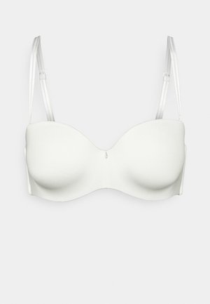 Soutien-gorge blanc rembourré avec un tissu lisse, des bonnets moulés et des bretelles ajustables. Caractéristiques d'un accent central subtil, conçu pour un soutien sans couture.
