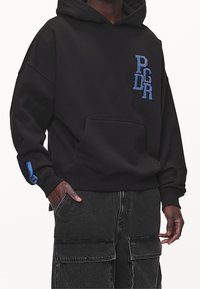 Pegador Luvtröja - black