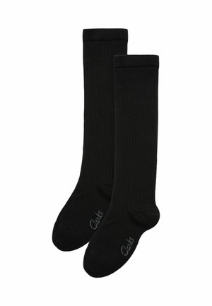 Chaussettes noires côtelées montantes en matériau doux, dotées d'un renfort au niveau des orteils et du talon. Logo de la marque affiché sur la semelle.