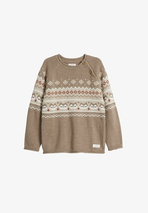 Brązowy sweter dzianinowy z okrągłym dekoltem. Posiada wzorzysty pas z sowami i geometrycznymi wzorami w odcieniach kremu i rdzy. Dwa guziki na ramieniu.