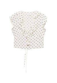White blouse featuring black polka dots, short flutter sleeves, ruffled front detail, and a drawstring hem for adjustable fit.