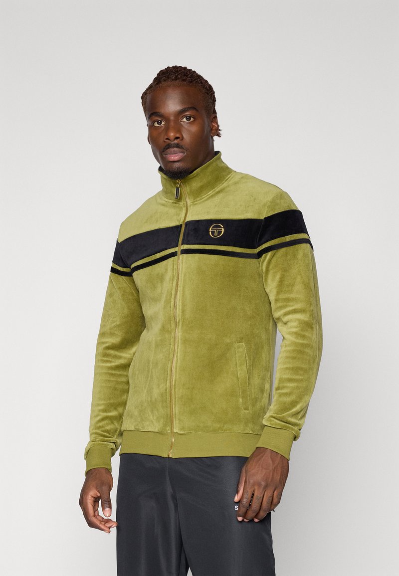 Olive green zip-up jacket in soft texture, featuring a black stripe with yellow accents across the chest and a logo on the left side.