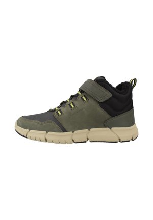 Green and black sneaker with beige thick sole, ankle-high design, Velcro strap, pull tab, and fleece lining.