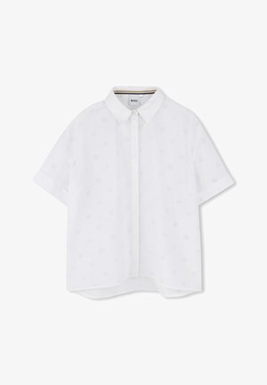 Fehér, rövid ujjú ing, galléros nyakkivágással, finom tonális mintákkal. Könnyű anyagból készült, laza fazonú és egyenes aljjal.