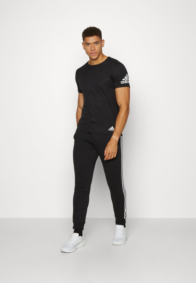adidas tapered tracksuit bottoms mens