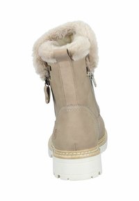 Beige Knöchelstiefel mit Kunstfellrand, Obermaterial aus glattem Leder und einer weißen, strukturierten Gummisohle. Verfügt über einen seitlichen Reißverschluss und ein dekoratives Etikett.