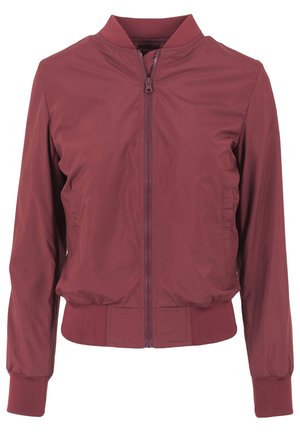 Burgundy bomberjacka gjord av slätt, lättviktigt tyg med dragkedja fram, ribbstickade ärmslut och midja. Har sidofickor.