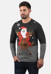 Dark gray sweater featuring a knitted design of Santa and a reindeer. Santa has a red hat, and the reindeer has a pom-pom nose. Snowflake accents.