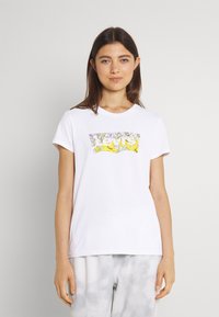 White cotton t-shirt with a colorful floral graphic design at the center. Short sleeves and a round neckline.