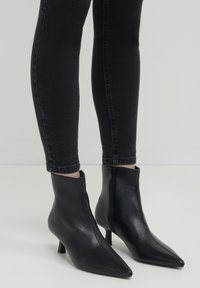 Calliope EFFETTO - Ankle Boot - nero