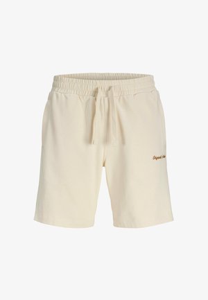 Pantalones cortos de algodón beige con cintura elástica y cordón ajustable. Bolsillos laterales y "Originals" bordado en marrón en la pierna izquierda.