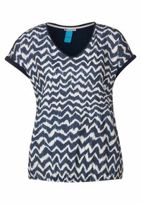 Haut à motifs en bleu marine et blanc, présentant un design en zigzag, des manches courtes, un décolleté en V et un ourlet élastiqué.