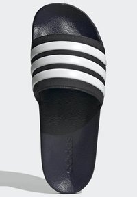 Black slide sandal with white three-stripe design, textured upper, and smooth sole; features embossed 'adidas' logo on footbed.