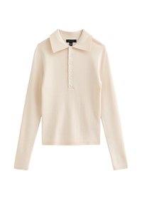 Maglia polo a maniche lunghe in morbido tessuto a costine beige chiaro. Presenta un collo classico e una patta con sei bottoni. Design semplice e aderente.