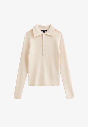 Polo met lange mouwen in een zachte, lichtbeige geribbelde stof. Heeft een klassieke kraag en een knoopsluiting met zes knopen. Eenvoudig en aansluitend model.