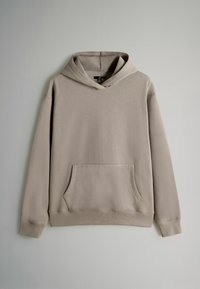 Beige hoodie med en framficka, dragsko i huva och ribbade manschetter. Tillverkad av mjukt material med en slät yta och minimalistisk design.
