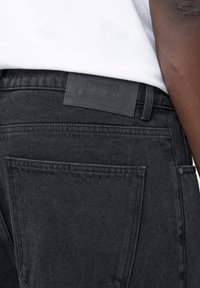 EIGHTYFIVE WITH LOOP - Baggy jeans - black washed