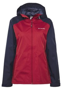 Röd och marinblå vindjacka med dragkedja fram, justerbar huva, foder av mesh inuti och logotyp på vänstra bröstet. Långa ärmar.