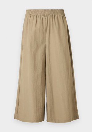 Pantalon beige large et court avec taille élastique, en tissu léger légèrement texturé, présenté à plat sur fond blanc.