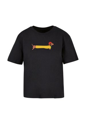 Black cotton t-shirt featuring a cartoon dachshund wearing a red hat and yellow jacket, designed in a playful, illustrated style.