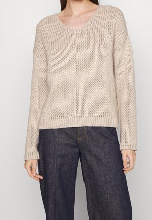 Stickad tröja - beige