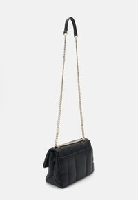 Black quilted leather handbag with a gold-tone chain strap and a top handle. Features a structured shape and a smooth texture.