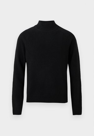 Crni džemper s rolkom i dugim rukavima, izrađen od mekane pletene tkanine. Ima rebrasti ovratnik i rub za pristajeći siluetu.