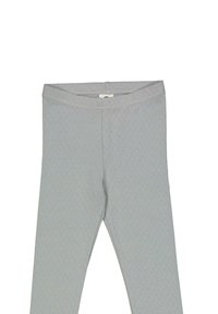 Harmaat leggings, jotka on valmistettu joustavasta kankaasta, ja joissa on teksturoitu kuvio sekä sileä vyötärönauha ilman näkyviä kiinnityksiä.